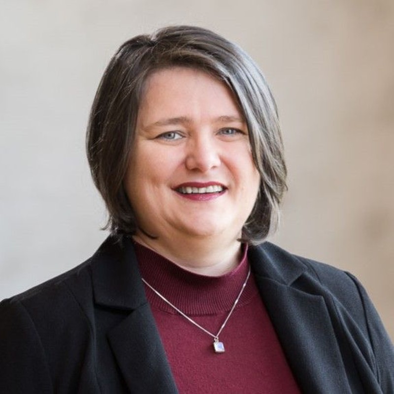 Headshot of Ildi Racz-Prosser